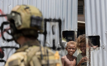 Solomon Islands: China mouthpiece blames Australia for ‘fomenting riots’ An Australian soldier on patrol in Honiara