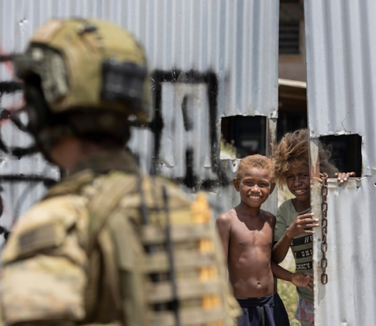 An Australian soldier on patrol in Honiara