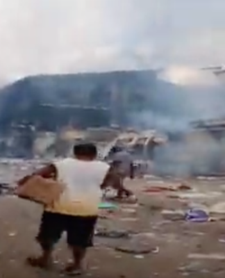 Solomons police overrun, Australia deploys support personnel The aftermath of rioting in Chinatown yesterday.