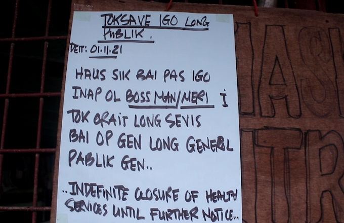 A "closed under bosses' orders" sign in Lae