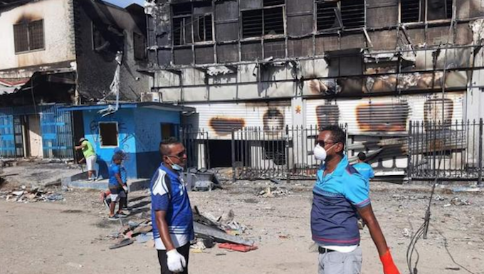 Solomon Islands riots: International community monitoring ‘nervous’ calm Fijian community help Bank of South Pacific staff clean up in Honiara