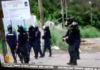 Armed police with teargas masks on guard in Honiara
