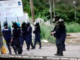 Armed police with teargas masks on guard in Honiara