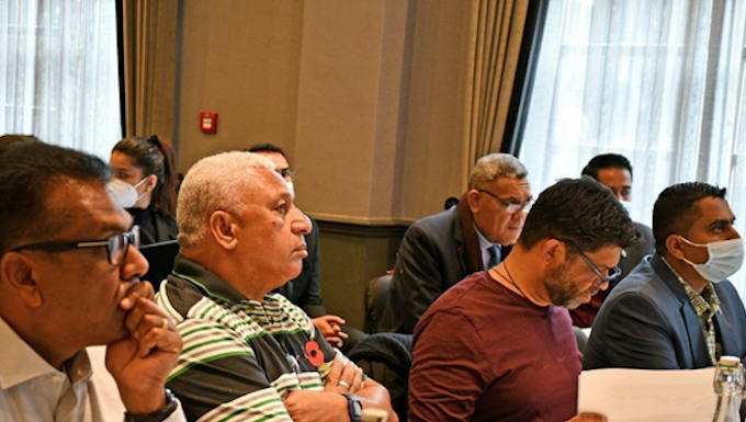 Fiji Prime Minister Voreqe Bainimarama being briefed at COP26