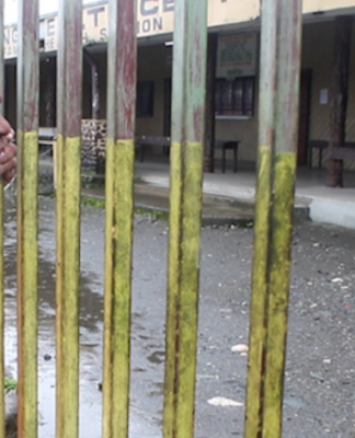Woman at closed Malahang Health Centre