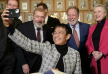 Nobel Peace Prize winner Maria Ressa takes a selfie