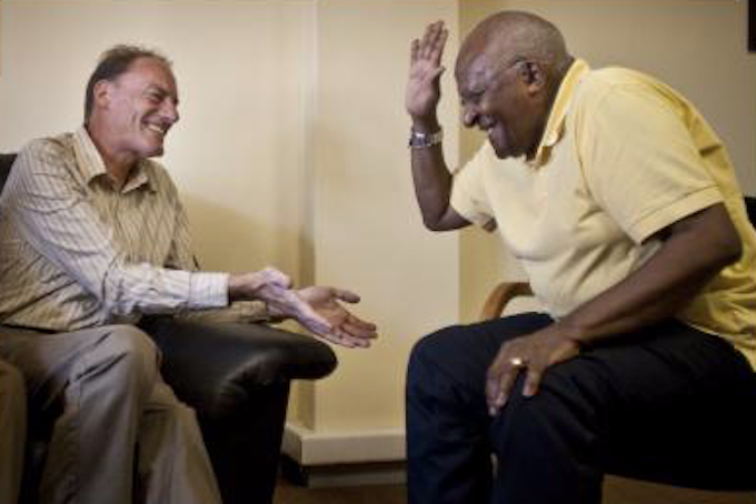 John Minto talking to Archbishop Desmond Tutu