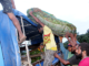 "Dignity" PMV crew loading a truck with produce