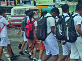 Fiji students walk to a secondary school in Suva