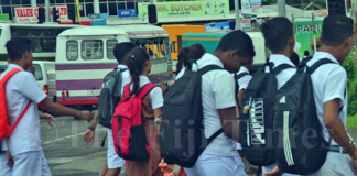 Fiji students walk to a secondary school in Suva
