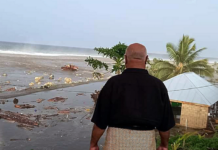 tsunami wave crashes into a Tongan house