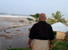 tsunami wave crashes into a Tongan house