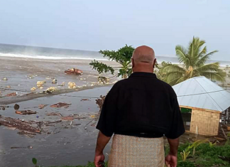 tsunami wave crashes into a Tongan house