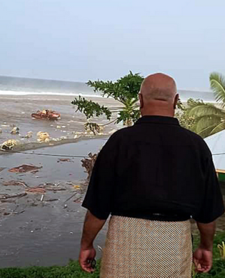 tsunami wave crashes into a Tongan house