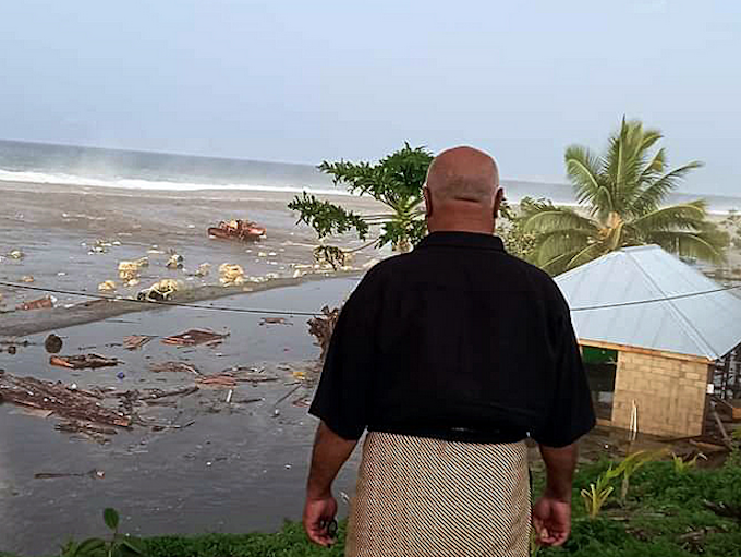 tsunami wave crashes into a Tongan house