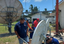 Digicel Tonga’s technical team working on satellite link equipment