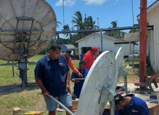 Digicel Tonga’s technical team working on satellite link equipment