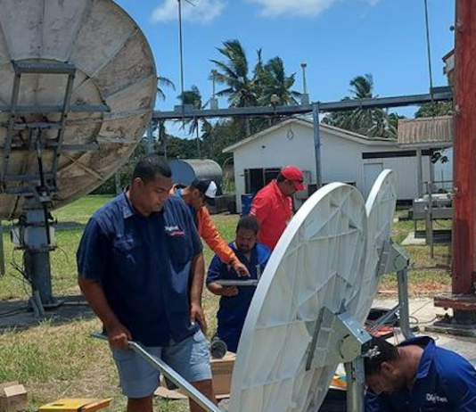 Digicel Tonga’s technical team working on satellite link equipment