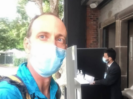 Dr Mark Craig takes a selfie as he arrives for work at a MIQ hotel in Auckland