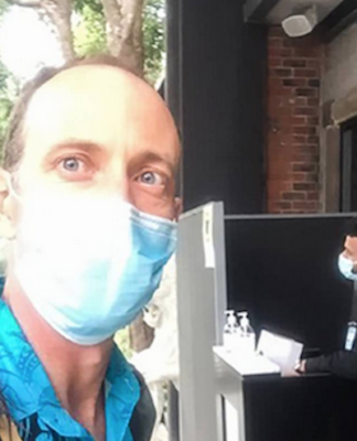 Dr Mark Craig takes a selfie as he arrives for work at a MIQ hotel in Auckland