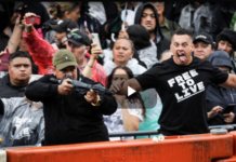 Anti-mandate protesters perform a haka on Parliament grounds