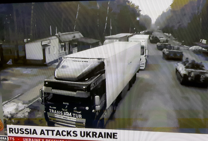 A column of Russian armoured vehicles enters Ukraine 