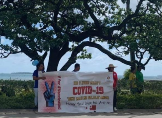 A #VForVaccinated banner in Tonga