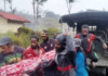 Relatives carry body of a 12-year-old Papuan boy