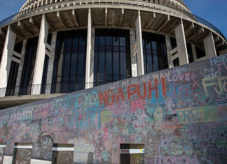Wall graffiti chalked up by anti-mandates protesters