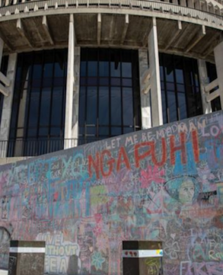 Wall graffiti chalked up by anti-mandates protesters