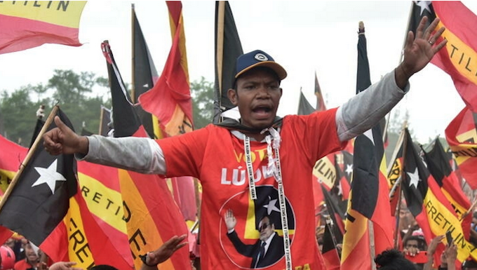 Two key Timor-Leste revolutionary heroes forced to presidency run-off Fretilin supporters at a pre-election rally