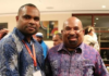Papuan student Laurens Ikinia (left) with Governor Lukas Enembe