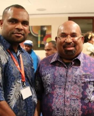 West Papuan students in dire straits in NZ after Indonesia cuts funding Papuan student Laurens Ikinia (left) with Governor Lukas Enembe