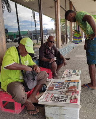 Newspaper street vendors in Honiara.