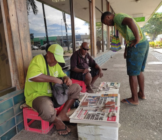 Newspaper street vendors in Honiara.
