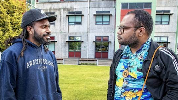 Laurens Ikinia (right) is advocating for a group of Papuan students