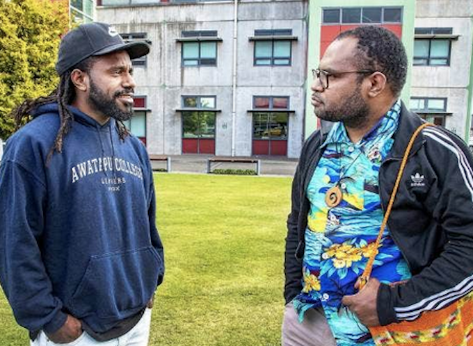 Laurens Ikinia (right) is advocating for a group of Papuan students