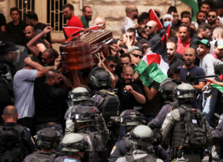 Israeli riot police attack pallbearers