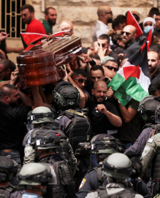 Israeli riot police attack pallbearers