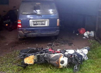 The burnt out motorbike in front of Papua LBH office