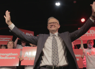 Australia's new Prime Minister Anthony Albanese with Strengthen Medicare placards