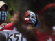 Papuan students, with their body and face painted with the colours of the banned Morning Star flag