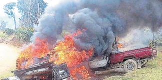 A mob set fire to these vehicles during PNG Energy Minister Saki Soloma's visit