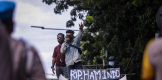 A Papuan protest in Jakarta with a banner reading "RIP Indonesian human rights"