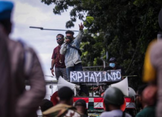 A Papuan protest in Jakarta with a banner reading "RIP Indonesian human rights"