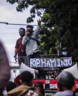 A Papuan protest in Jakarta with a banner reading "RIP Indonesian human rights"