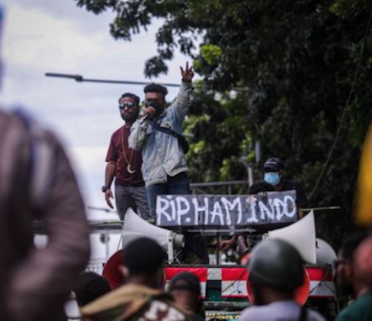 A Papuan protest in Jakarta with a banner reading "RIP Indonesian human rights"