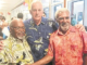 Madang's Sir Peter Barter (centre) passes on