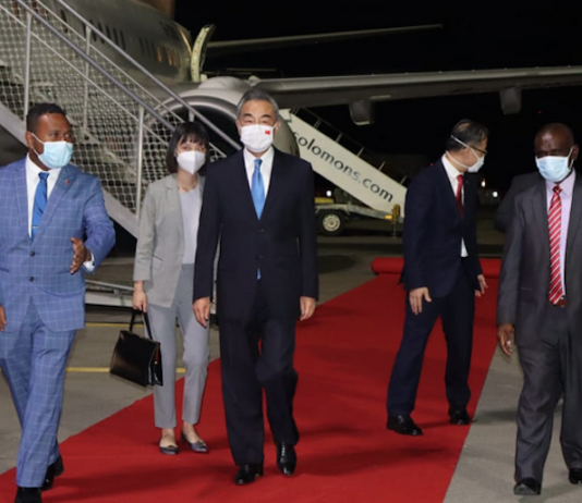 China's Foreign Minister Wang Yi (centre)