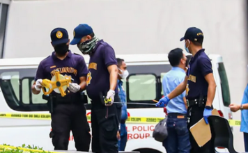 Three killed, including former mayor, in Manila university campus shooting Philippine police inspect the assassination crime scene at the Ateneo de Manila University